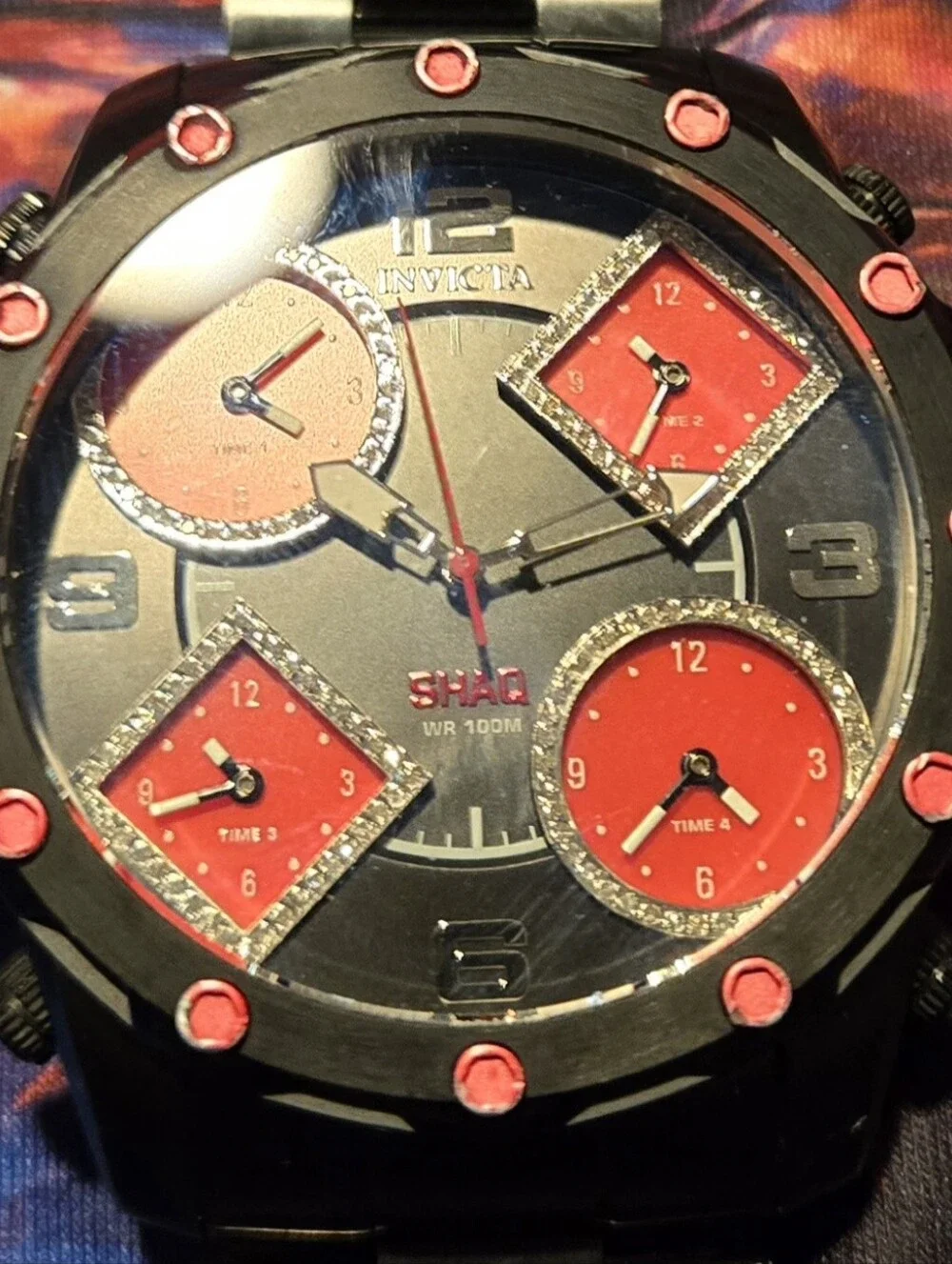 Invicta Men’s Black Watch with Red Dial Accents